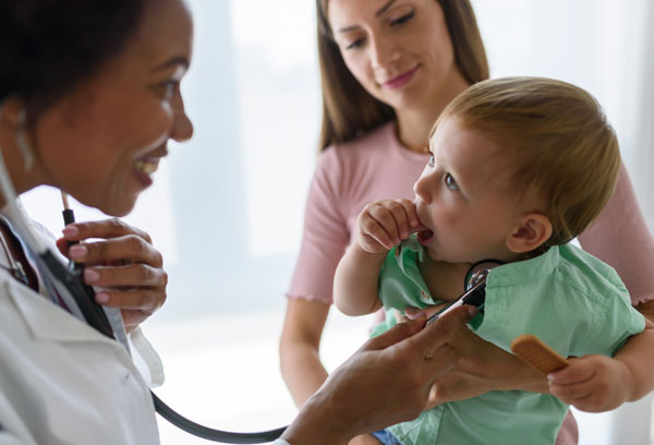 Doctor with mother and child