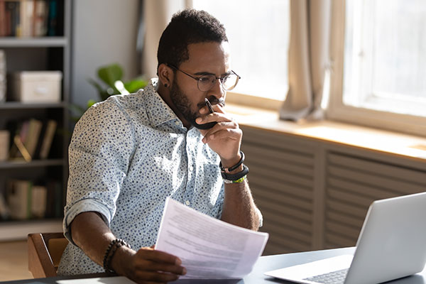 Man reading on a laptop