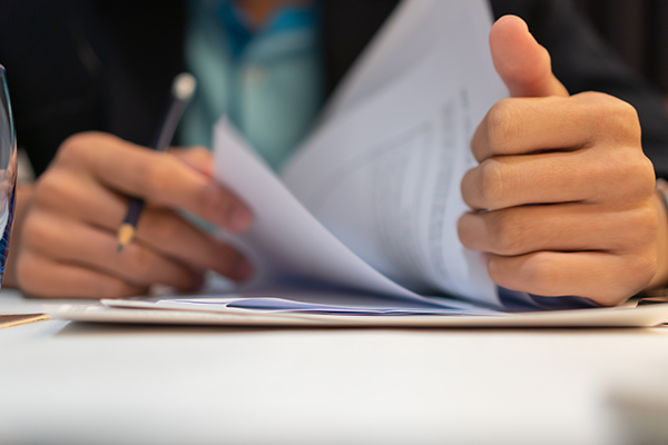 closeup of reports being read by a businessman